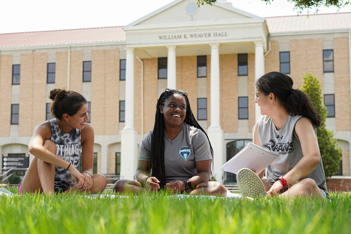 College Students Studying with Notes They Can Sell to Make Extra Money as a Side Hustle