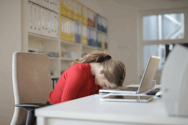 Person reviewing performance documents on laptop for career growth